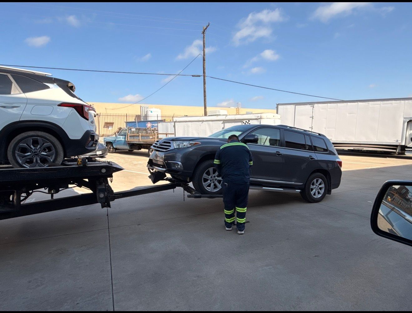 Texas Towing operator loading a vehicle